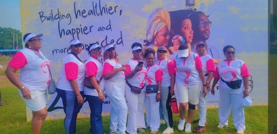 MenoClub members in front of the "Building healthier, happier and more connected" banner